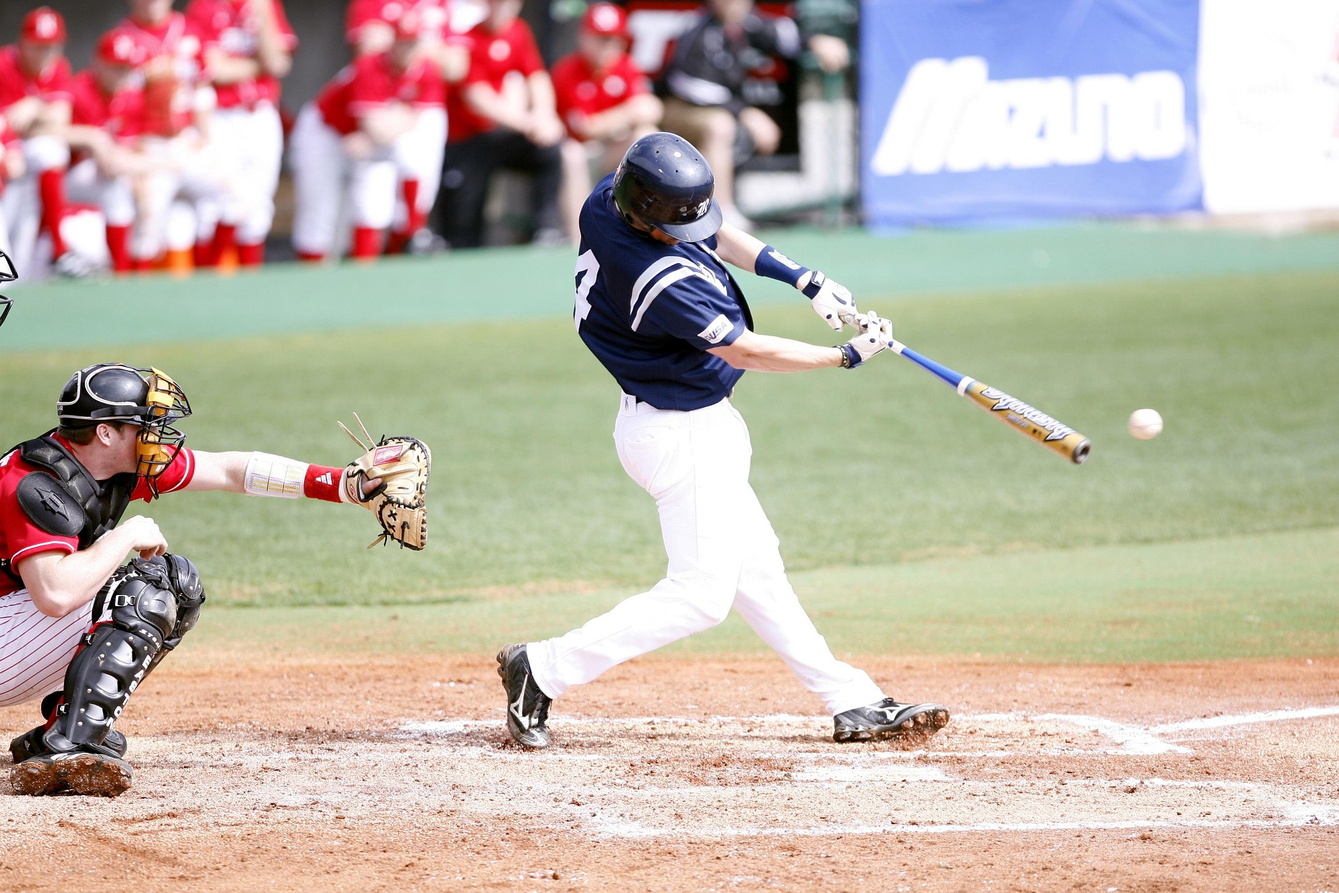 Baseball player hitting a ball